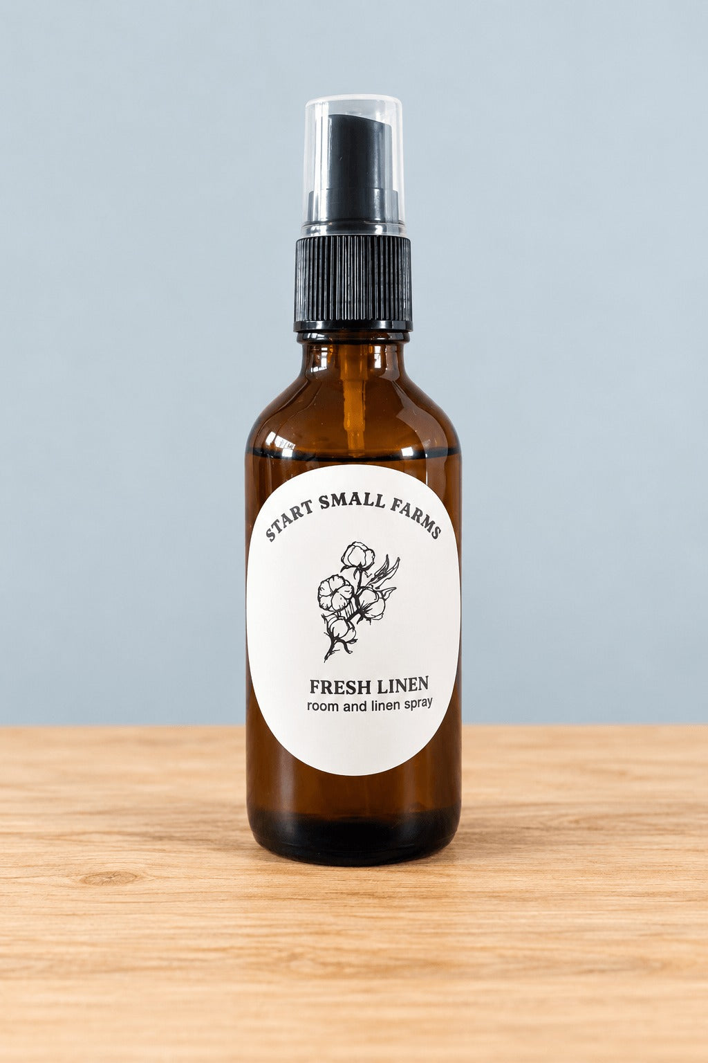 Room & Linen Spray in Fresh Linen, a 4oz amber glass bottle with a black spray top