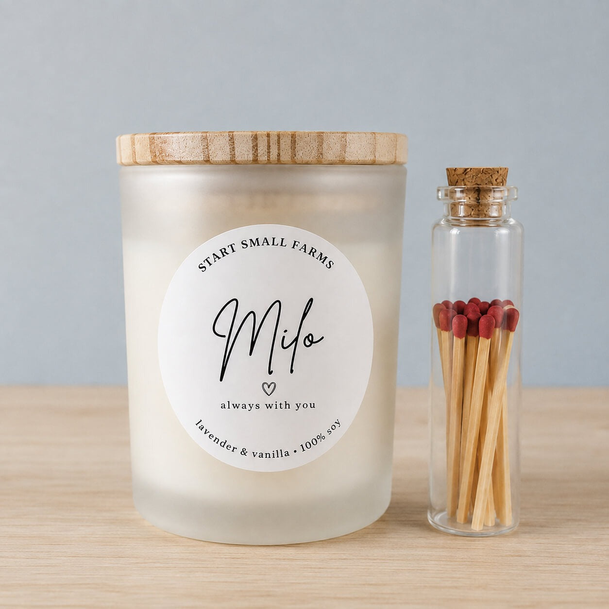 A frosted soy candle with a bamboo lid, labelled Milo, always with you, lavender and vanilla, 100% soy