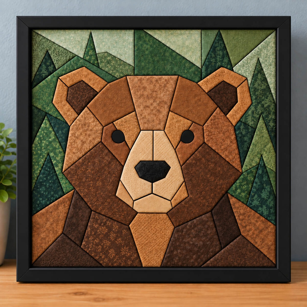 The same chunky brown bear design in a black frame, standing on a wooden shelf.