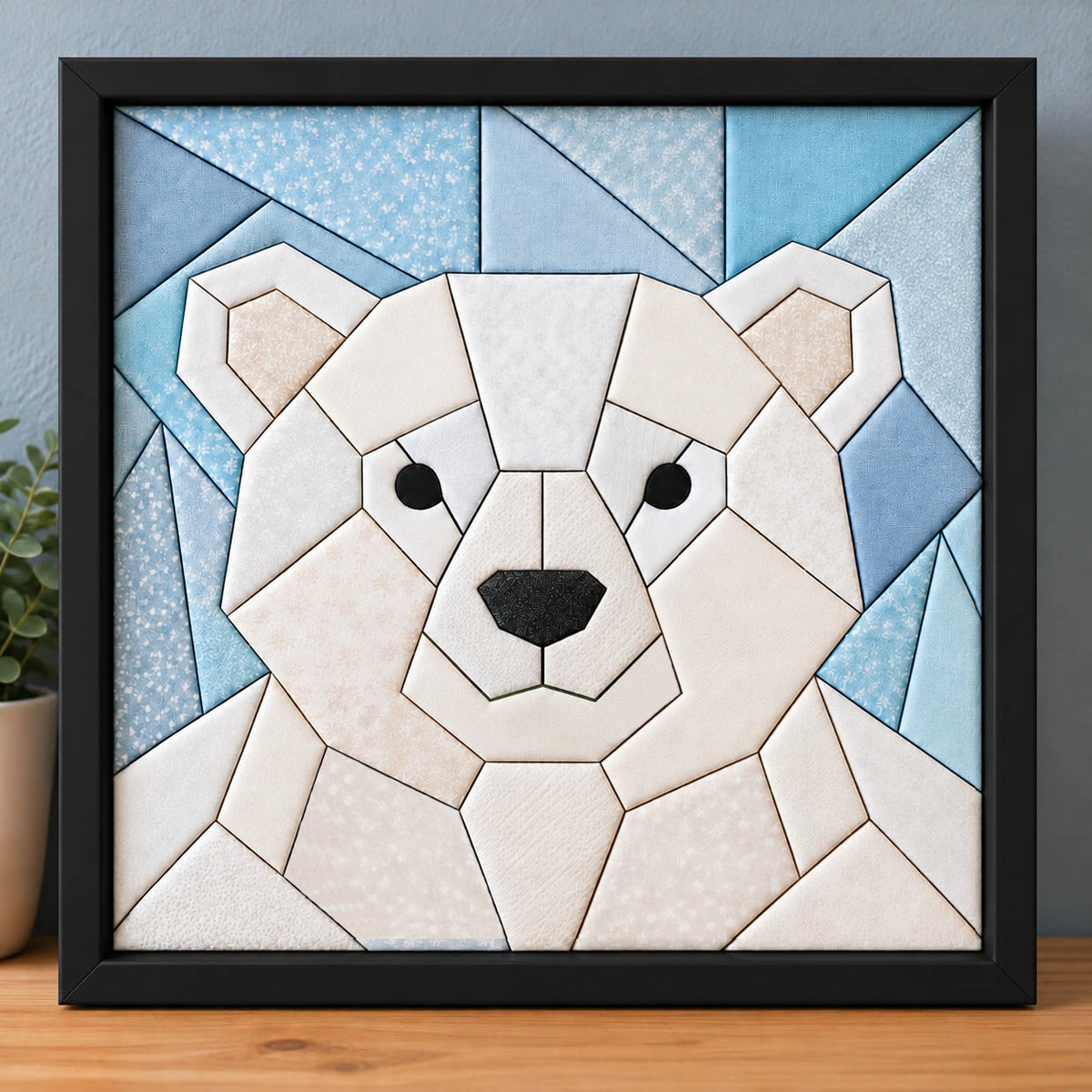 The same chunky polar bear design in a black frame, standing on a wooden shelf.