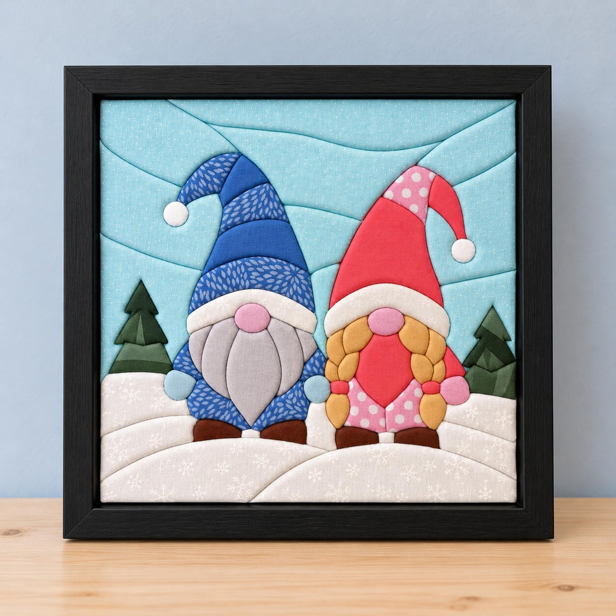 The same gnome design in a black frame, standing on a wooden shelf.