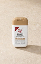 The Tongo DEET-free fragrance-free insect repellent, a 1 fl oz white pump spray with a tan cap, on pale stone