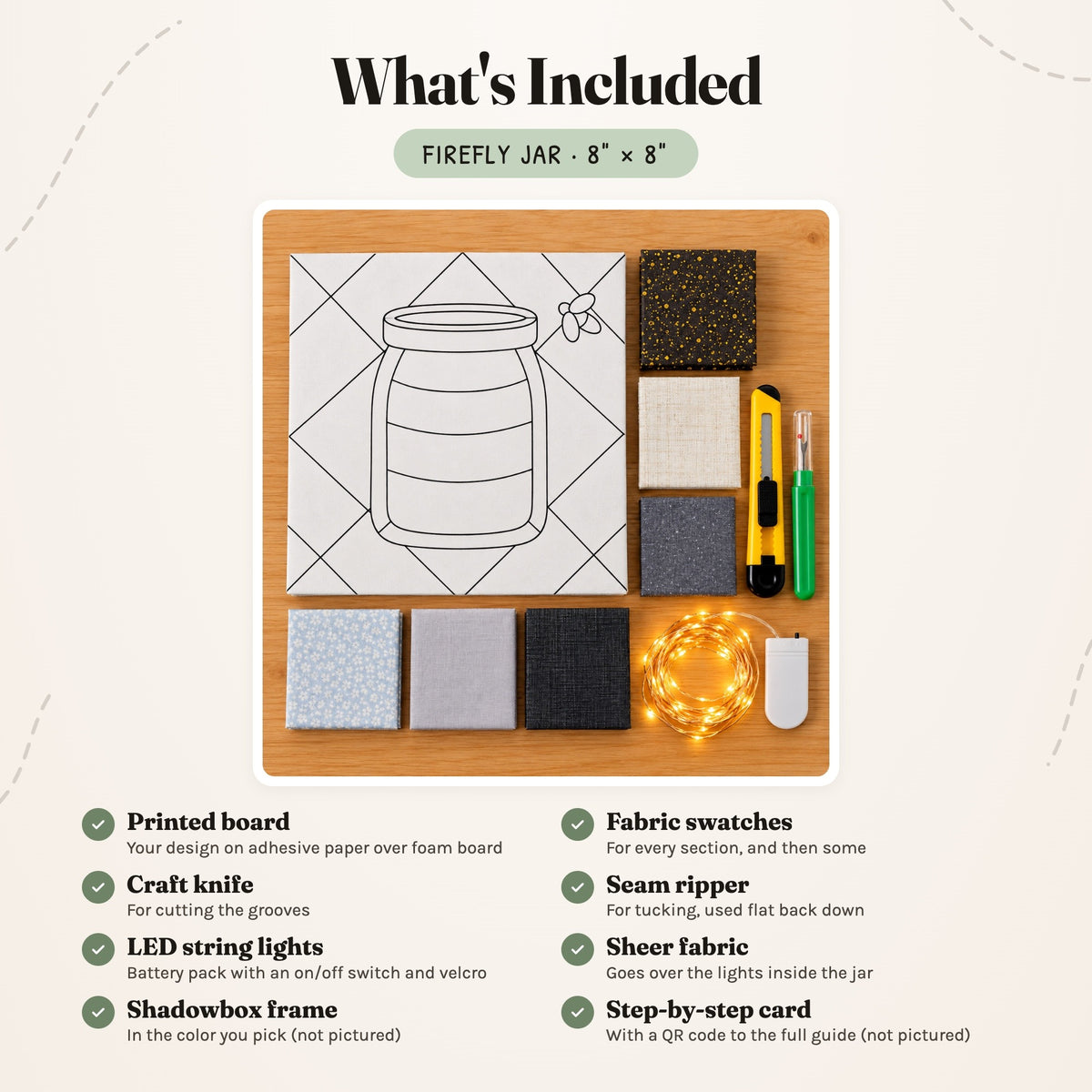 What's included in the Firefly Jar kit, laid out on a wood table: the printed board, fabric swatches, a craft knife and a seam ripper, plus LED string lights with a battery pack. The shadowbox frame and the step-by-step card are not pictured.
