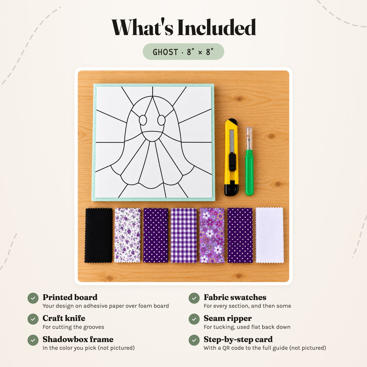 What's included in the Ghost kit, laid out on a wood table: the printed board, fabric swatches, a craft knife and a seam ripper. The shadowbox frame and the step-by-step card are not pictured.