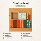 What's included in the Pumpkin kit, laid out on a wood table: the printed board, fabric swatches, a craft knife, a seam ripper and the natural wood shadowbox. The step-by-step card is not pictured.