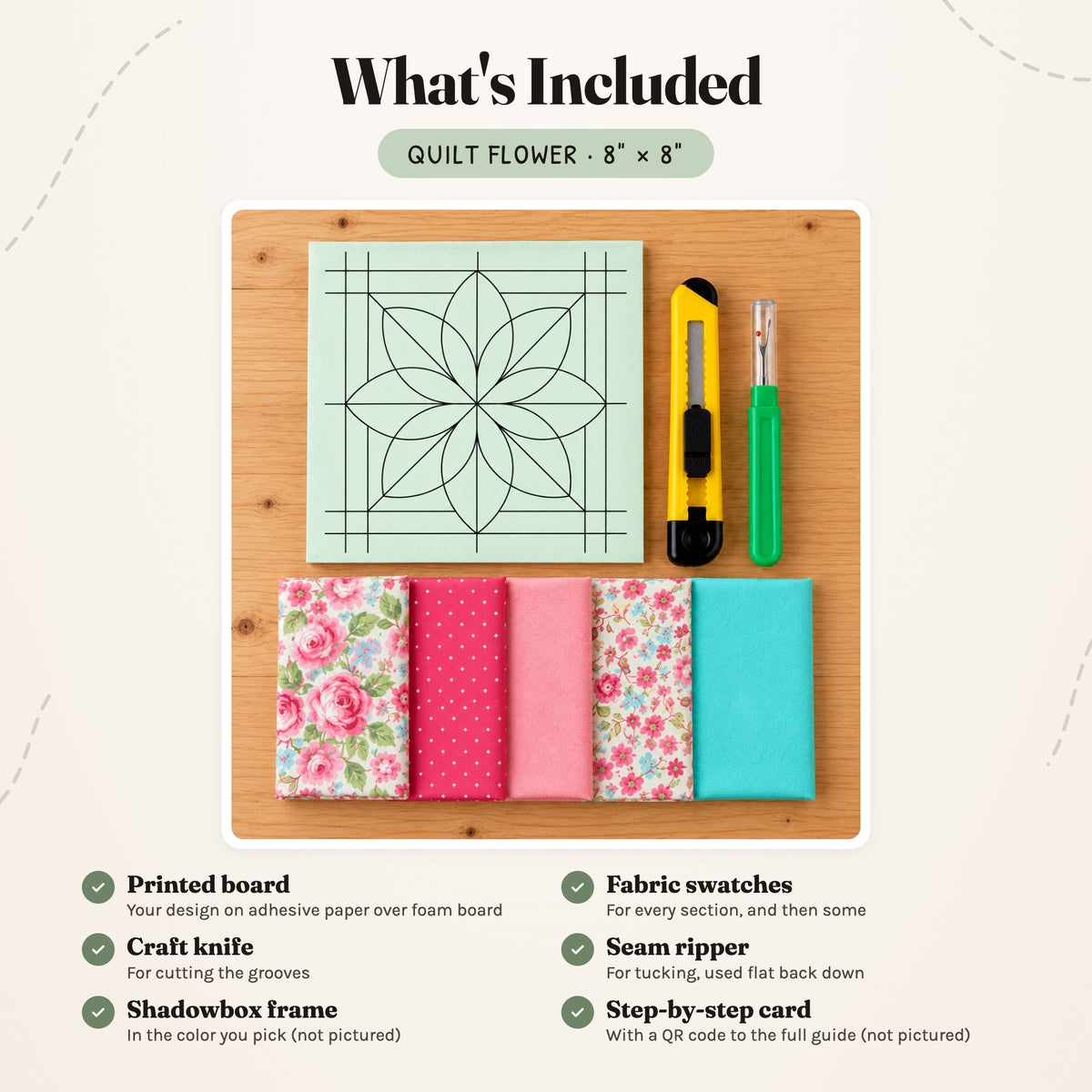 What's included in the Quilt Flower kit, laid out on a wood table: the printed board, fabric swatches, a craft knife and a seam ripper. The shadowbox frame and the step-by-step card are not pictured.